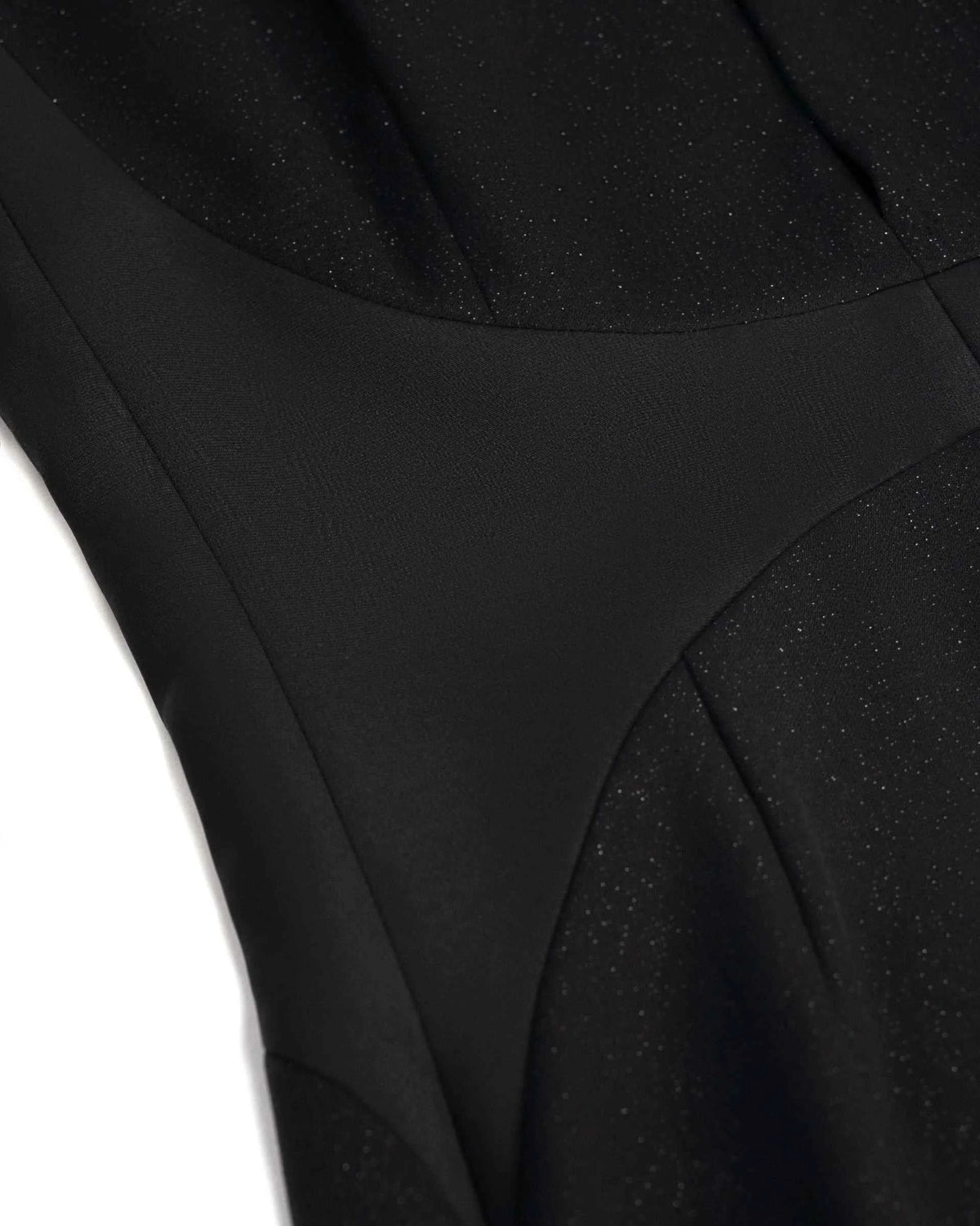 The close view reveals smooth dark panels and a clear seam through the bodice.