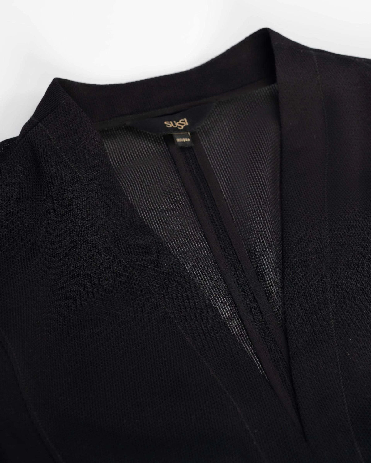 The shaped collar and front edges create a defined opening above a smooth inner surface.