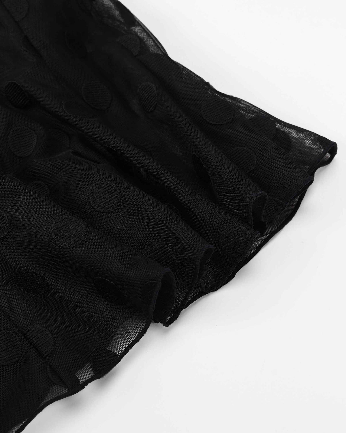 The lower section opens beneath the waist and ends beside a fine transparent border.