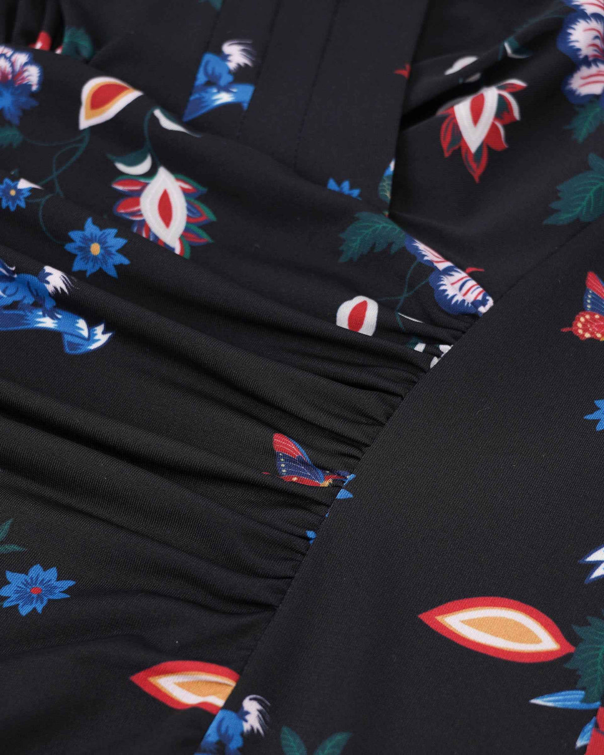 Closely spaced folds gather at the waist and change direction across the wrapped front.