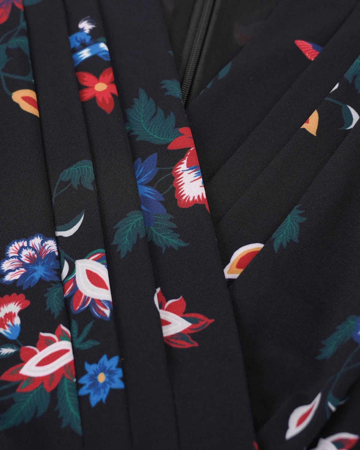 The fabric falls into diagonal folds across the body, giving the wrapped silhouette a soft sense of movement.