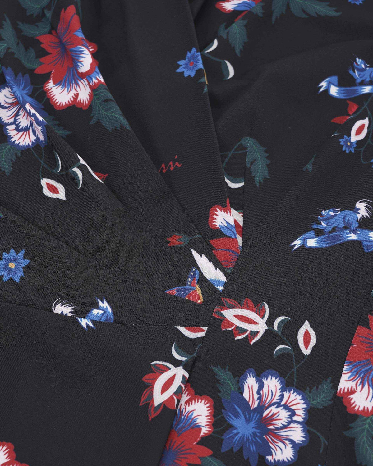 Pair the blouse with a plain dark lower layer to create a composed outfit.