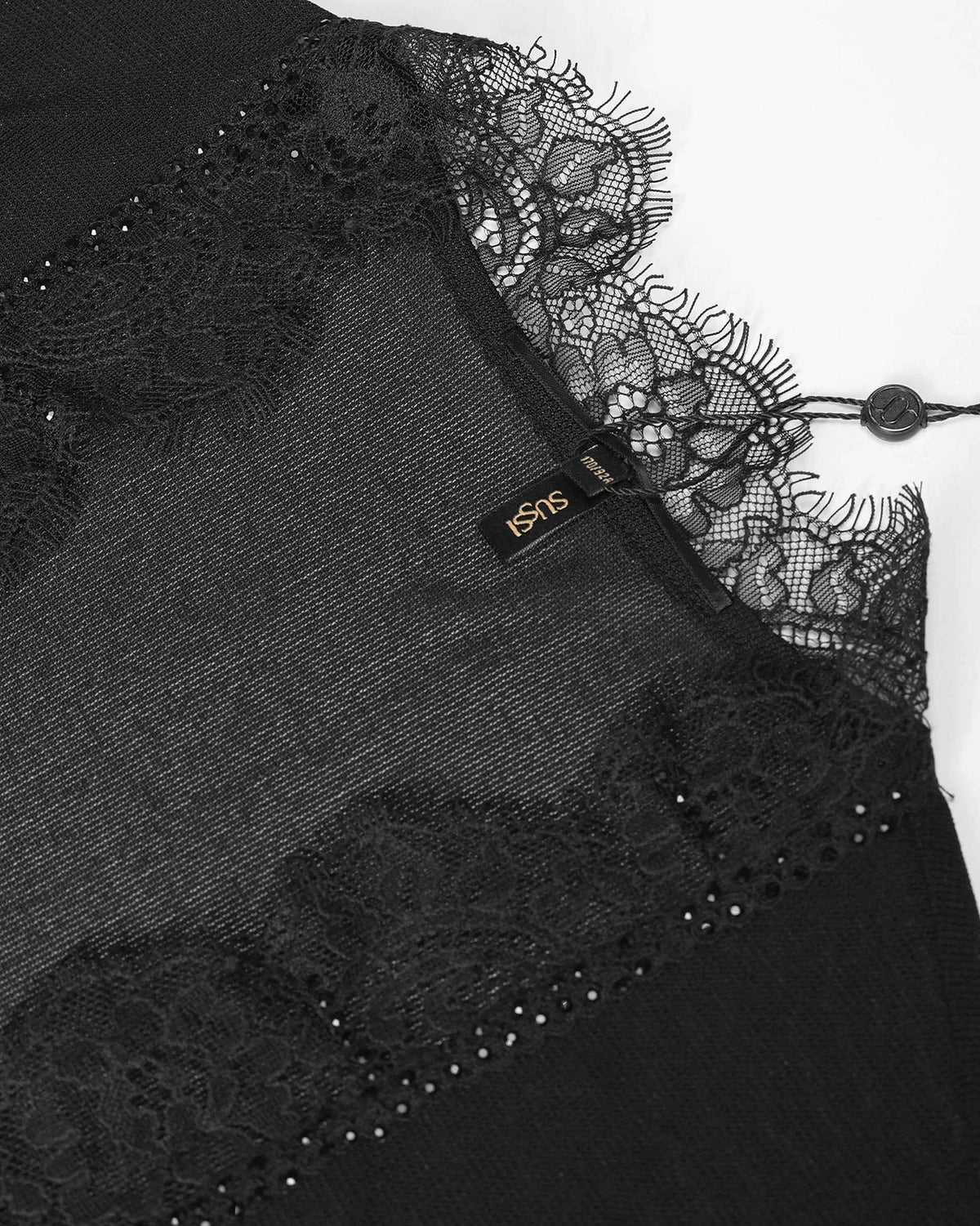 A small fastening sits beside the lace at the neckline.