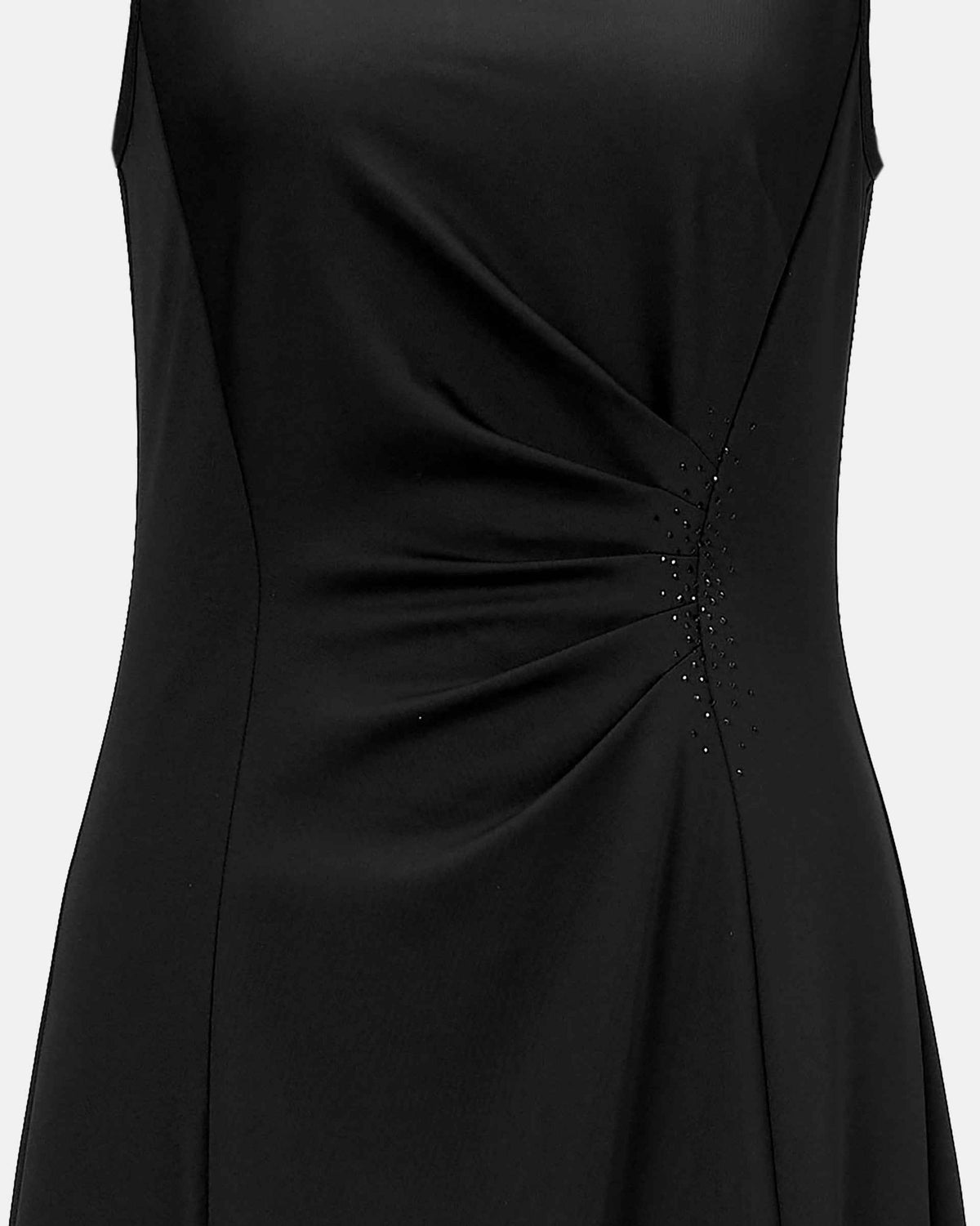 The fabric gathers into a series of close folds at the waist, changing direction across the body.
