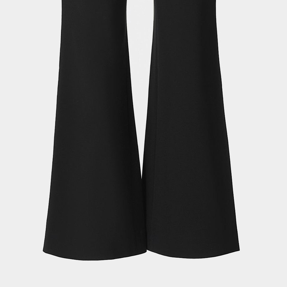 The trouser legs widen subtly toward their cropped hems, creating a clean, curved outline.