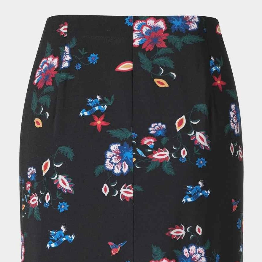 A black top picks up the skirt's dark base and creates a connected outfit.
