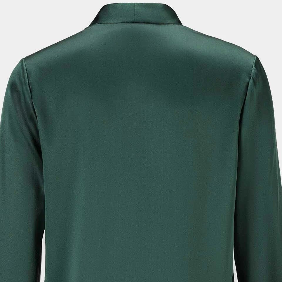 The back reveals a smooth expanse of deep green framed by long sleeves.