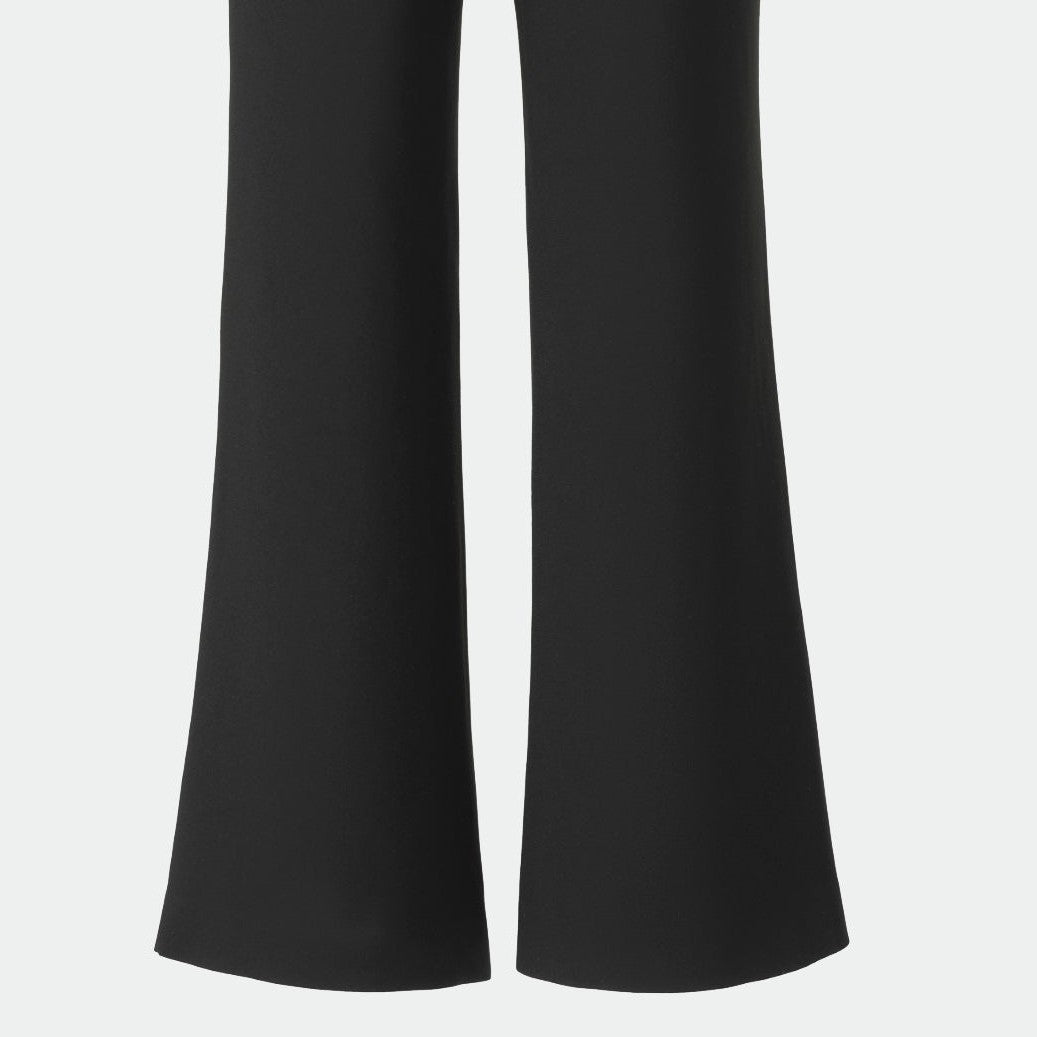The back legs widen towards their lower edges through plain black fabric.